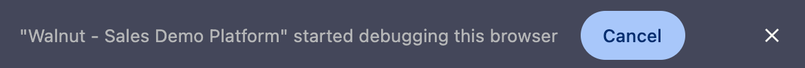 Debugger banner displayed at the top of the browser window in Walnut Extension